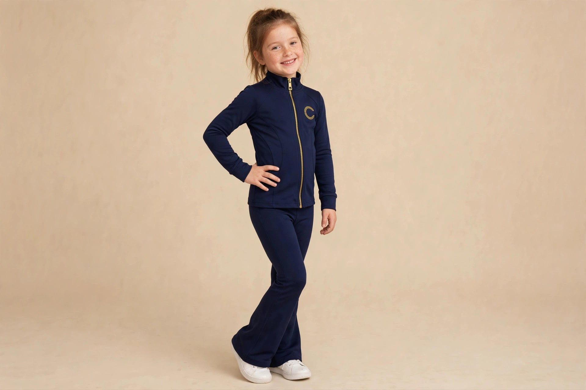 Comfort Kids navy zip-up and Athletic Flares set on a young model — something new is coming