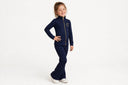 Comfort Kids navy zip-up and Athletic Flares set on a young model posing on a white background — new arrival coming soon